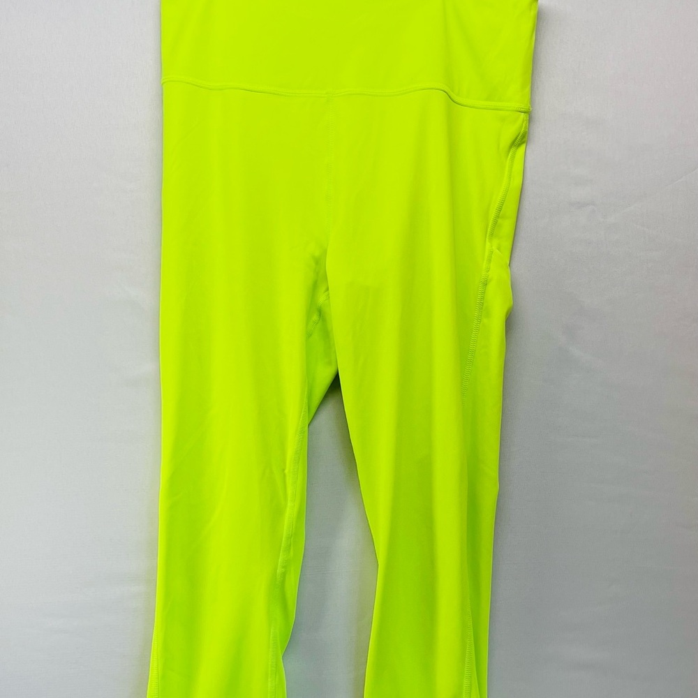 Athleta Neon Green ultimate stash pocket 7/8 Tights